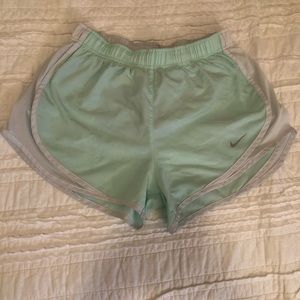White and mint green Nike shorts
